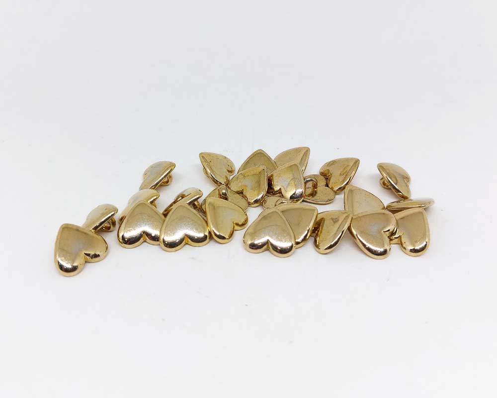 Botón dorado corazón